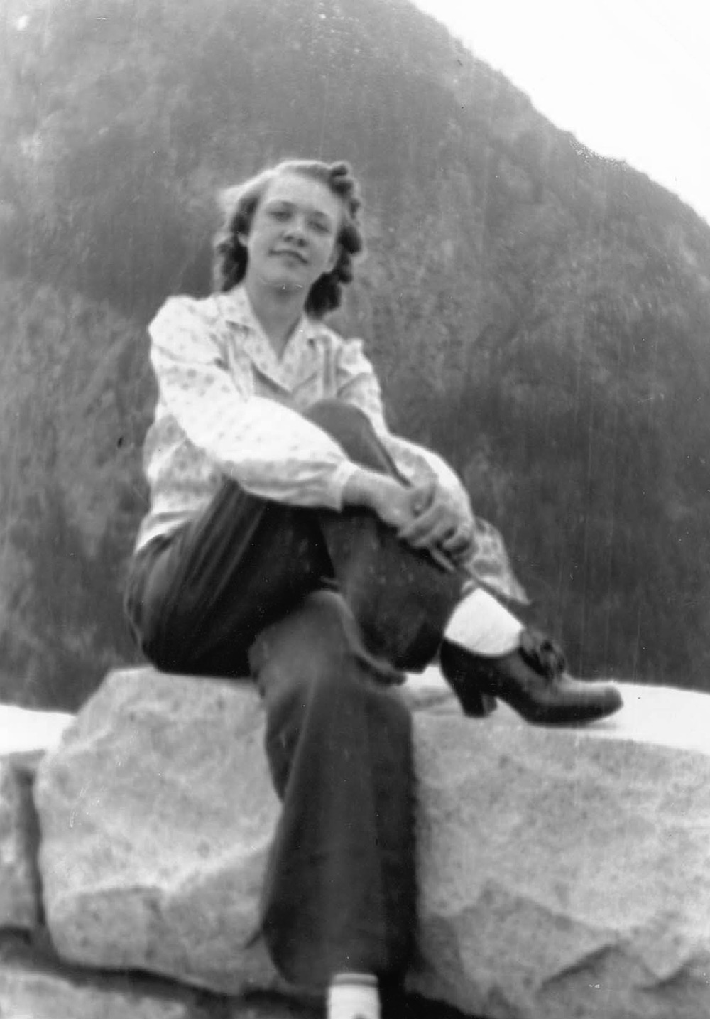 Eunice Schmidt Sitting on a Cliff